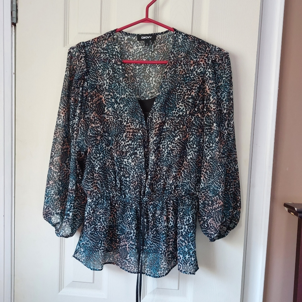 Pretty little DKNY sheer peplum blouse with ties. Black tank.